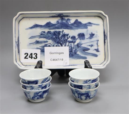 Six 19th century Chinese blue and white horses tea bowls and a later blue and white tray, length 16cm